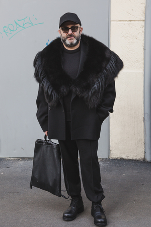MILAN, ITALY - JANUARY 14: Fashionable man poses outside Federico Curradi fashion show during Milan Men's Fashion Week on JANUARY 14, 2018 in Milan.のeditorial素材