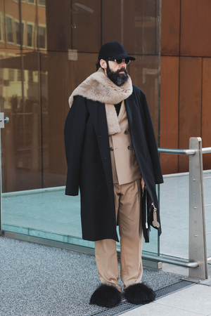 MILAN, ITALY - JANUARY 14: Fashionable man poses outside Federico Curradi fashion show during Milan Men's Fashion Week on JANUARY 14, 2018 in Milan.のeditorial素材