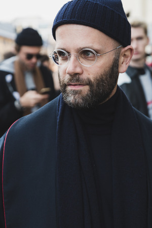MILAN, ITALY - JANUARY 14: Fashionable man poses outside Federico Curradi fashion show during Milan Men's Fashion Week on JANUARY 14, 2018 in Milan.のeditorial素材