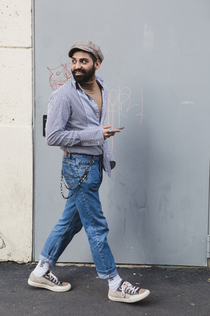 MILAN, ITALY - JANUARY 14: Fashionable man poses outside Federico Curradi fashion show during Milan Men's Fashion Week on JANUARY 14, 2018 in Milan.のeditorial素材