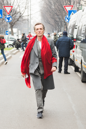 MILAN, ITALY - JANUARY 15: Fashionable man poses outside Armani fashion show during Milan Men's Fashion Week on JANUARY 15, 2018 in Milan.のeditorial素材