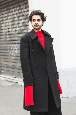 MILAN, ITALY - JANUARY 15: Fashionable man poses outside Armani fashion show during Milan Men's Fashion Week on JANUARY 15, 2018 in Milan.のeditorial素材