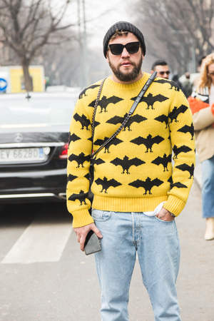 MILAN, ITALY - JANUARY 15: Fashionable man poses outside Armani fashion show during Milan Men's Fashion Week on JANUARY 15, 2018 in Milan.のeditorial素材