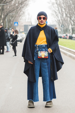MILAN, ITALY - JANUARY 15: Fashionable woman poses outside Armani fashion show during Milan Men's Fashion Week on JANUARY 15, 2018 in Milan.のeditorial素材