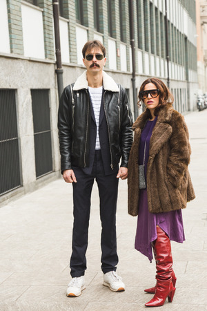 MILAN, ITALY - JANUARY 15: Fashionable people pose outside Armani fashion show during Milan Men's Fashion Week on JANUARY 15, 2018 in Milan.のeditorial素材