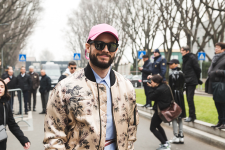 MILAN, ITALY - JANUARY 15: Fashionable man poses outside Armani fashion show during Milan Men's Fashion Week on JANUARY 15, 2018 in Milan.のeditorial素材