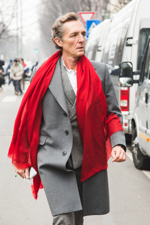 MILAN, ITALY - JANUARY 15: Fashionable man poses outside Armani fashion show during Milan Men's Fashion Week on JANUARY 15, 2018 in Milan.のeditorial素材
