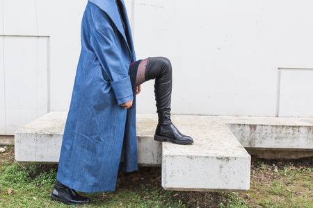 Detail of a beautiful young Indian woman posing in an urban context. Street fashion and style.の写真素材