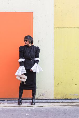 Beautiful young Indian woman posing in an urban context. Street fashion and style.の写真素材