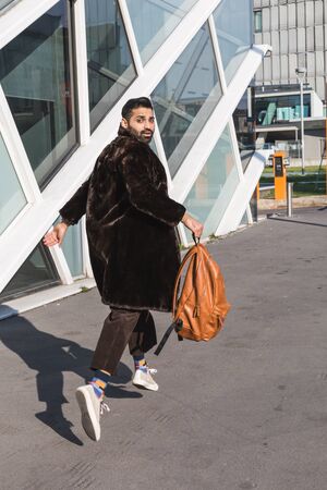Handsome Indian man posing in an urban context. Street fashion and style.の写真素材