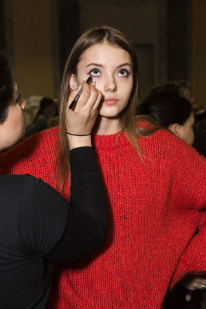 MILAN, ITALY - FEBRUARY 25: Gorgeous model has her make up done in the backstage before Piccione.Piccione show during Milan Women's Fashion Week on FEBRUARY 25, 2018 in Milan.のeditorial素材
