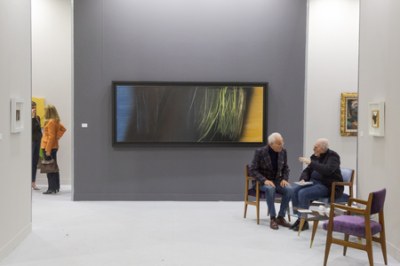 MILAN, ITALY - APRIL 13: Exhibitors are seen in their stand at Miart, international exhibition of modern and contemporary art on APRIL 13, 2018 in Milan.のeditorial素材