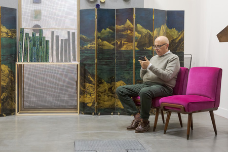 MILAN, ITALY - APRIL 13: Exhibitor is seen in his stand at Miart, international exhibition of modern and contemporary art on APRIL 13, 2018 in Milan.のeditorial素材