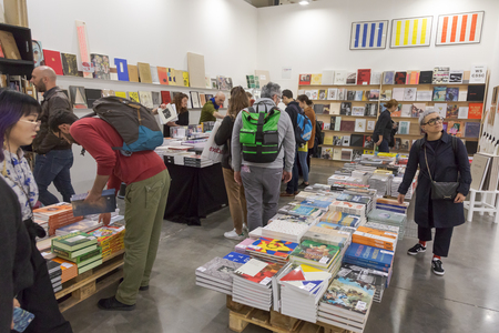 MILAN, ITALY - APRIL 13: People visit the bookstore at Miart, international exhibition of modern and contemporary art on APRIL 13, 2018 in Milan.のeditorial素材