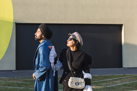 Beautiful Indian couple posing in an urban context. Street fashion and style.の写真素材