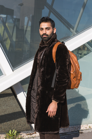 Handsome Indian man posing in an urban context. Street fashion and style.の写真素材