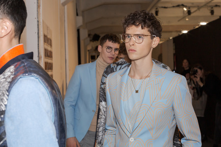 MILAN, ITALY - JANUARY 12: Beautiful models pose in the backstage just before Miguel Vieira show during Milan Men's Fashion Week on JANUARY 12, 2019 in Milan.のeditorial素材