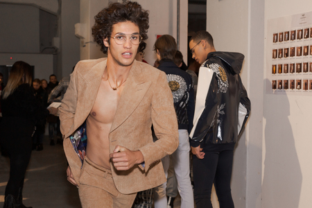 MILAN, ITALY - JANUARY 12: Beautiful model runs in the backstage just before Miguel Vieira show during Milan Men's Fashion Week on JANUARY 12, 2019 in Milan.のeditorial素材