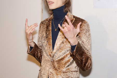 MILAN, ITALY - JANUARY 12: Beautiful model poses in the backstage just before Miguel Vieira show during Milan Men's Fashion Week on JANUARY 12, 2019 in Milan.のeditorial素材