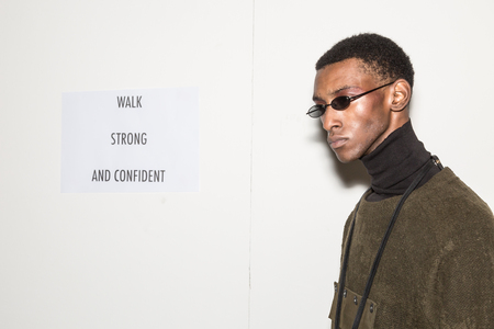 MILAN, ITALY - JANUARY 13: Beautiful model poses in the backstage just before Miaoran show during Milan Men's Fashion Week on JANUARY 13, 2019 in Milan.のeditorial素材