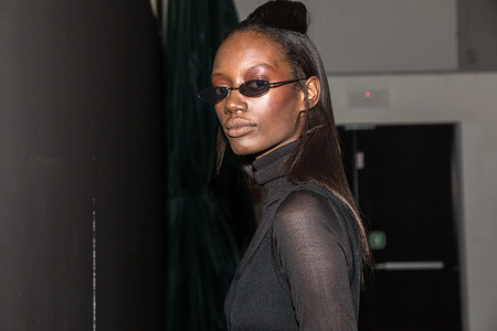 MILAN, ITALY - JANUARY 13: Beautiful model poses in the backstage just before Miaoran show during Milan Men's Fashion Week on JANUARY 13, 2019 in Milan.のeditorial素材