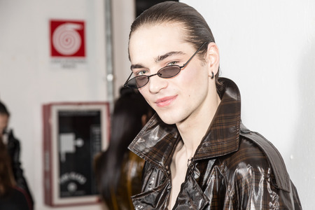 MILAN, ITALY - JANUARY 13: Beautiful model poses in the backstage just before Miaoran show during Milan Men's Fashion Week on JANUARY 13, 2019 in Milan.のeditorial素材