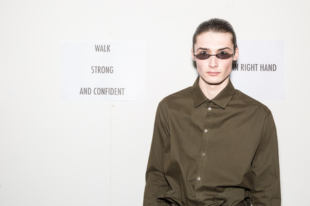 MILAN, ITALY - JANUARY 13: Beautiful model poses in the backstage just before Miaoran show during Milan Men's Fashion Week on JANUARY 13, 2019 in Milan.のeditorial素材