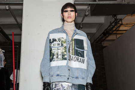 MILAN, ITALY - JANUARY 13: Beautiful model poses in the backstage just before Miaoran show during Milan Men's Fashion Week on JANUARY 13, 2019 in Milan.のeditorial素材