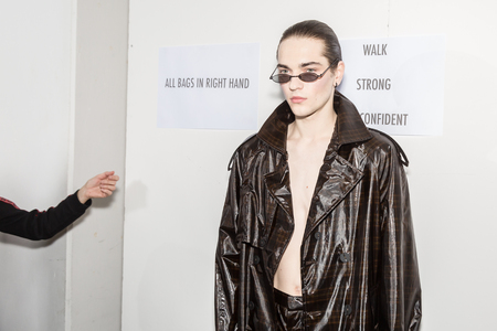 MILAN, ITALY - JANUARY 13: Beautiful model poses in the backstage just before Miaoran show during Milan Men's Fashion Week on JANUARY 13, 2019 in Milan.のeditorial素材