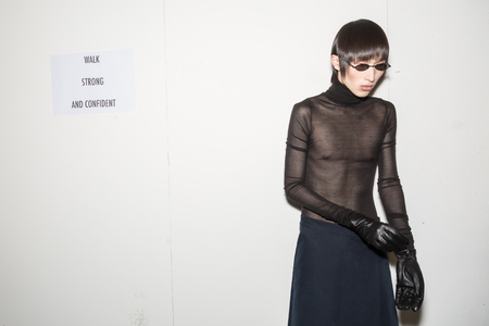MILAN, ITALY - JANUARY 13: Beautiful model poses in the backstage just before Miaoran show during Milan Men's Fashion Week on JANUARY 13, 2019 in Milan.のeditorial素材