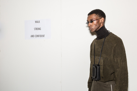 MILAN, ITALY - JANUARY 13: Beautiful model poses in the backstage just before Miaoran show during Milan Men's Fashion Week on JANUARY 13, 2019 in Milan.のeditorial素材