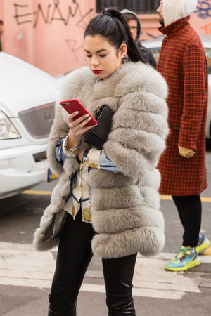 MILAN, ITALY - JANUARY 12: Fashionable woman poses outside Magliano fashion show during Milan Men's Fashion Week on JANUARY 12, 2019 in Milan.のeditorial素材