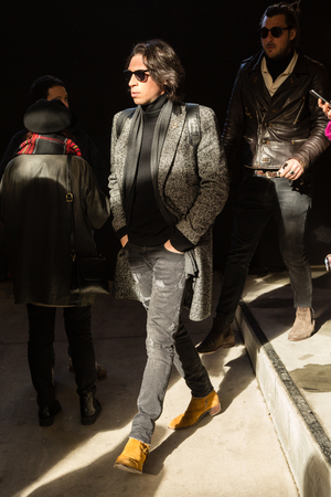 MILAN, ITALY - JANUARY 12: Fashionable man poses outside Magliano fashion show during Milan Men's Fashion Week on JANUARY 12, 2019 in Milan.のeditorial素材