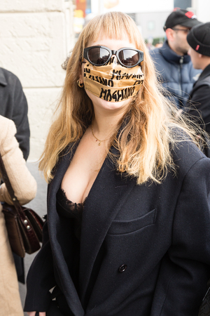 MILAN, ITALY - JANUARY 12: Fashionable woman poses outside Magliano fashion show during Milan Men's Fashion Week on JANUARY 12, 2019 in Milan.のeditorial素材