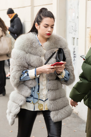MILAN, ITALY - JANUARY 12: Fashionable woman poses outside Magliano fashion show during Milan Men's Fashion Week on JANUARY 12, 2019 in Milan.のeditorial素材