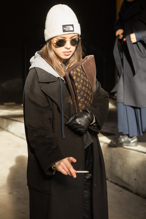 MILAN, ITALY - JANUARY 12: Fashionable woman poses outside Magliano fashion show during Milan Men's Fashion Week on JANUARY 12, 2019 in Milan.のeditorial素材