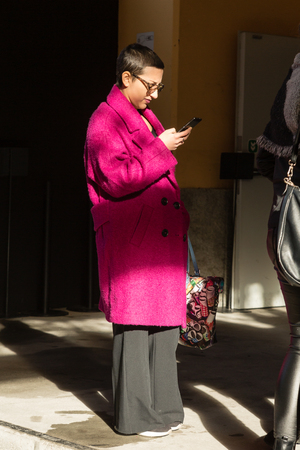 MILAN, ITALY - JANUARY 12: Fashionable woman poses outside Magliano fashion show during Milan Men's Fashion Week on JANUARY 12, 2019 in Milan.のeditorial素材