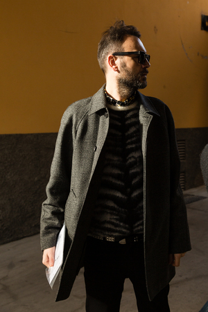 MILAN, ITALY - JANUARY 12: Fashionable man poses outside Magliano fashion show during Milan Men's Fashion Week on JANUARY 12, 2019 in Milan.のeditorial素材