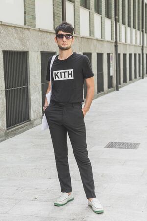 MILAN, ITALY - JUNE 15: Fashionable man poses outside Armani fashion show during Milan Men's Fashion Week on JUNE 15, 2019 in Milan.のeditorial素材