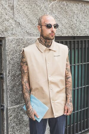 MILAN, ITALY - JUNE 15: Fashionable man poses outside Armani fashion show during Milan Men's Fashion Week on JUNE 15, 2019 in Milan.のeditorial素材