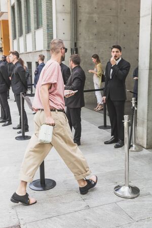 MILAN, ITALY - JUNE 15: Fashionable man poses outside Armani fashion show during Milan Men's Fashion Week on JUNE 15, 2019 in Milan.のeditorial素材
