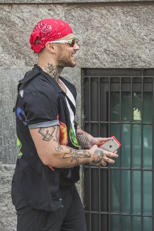 MILAN, ITALY - JUNE 15: Fashionable man poses outside Armani fashion show during Milan Men's Fashion Week on JUNE 15, 2019 in Milan.のeditorial素材