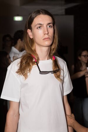 MILAN, ITALY - JUNE 17: Beautiful model poses in the backstage just before Edithmarcel show during Milan Men's Fashion Week on JUNE 17, 2019 in Milan.のeditorial素材