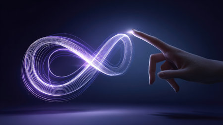 An illuminated infinity symbol is depicted with a hand reaching towards it. The symbol is rendered with glowing, neon-like light, contrasted against a dark background. The scene suggests a futuristic aesthetic with a touch of surrealism. Potential applications include technology, science, and conceptual design projects.の素材