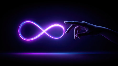 An illuminated infinity symbol is featured in this image, rendered in vibrant neon blue and purple hues. A hand reaches out towards the symbol, with a focus on its connection. The composition is set against a dark backdrop, creating a sense of depth and mystery, suitable for various conceptual and design applications.の素材