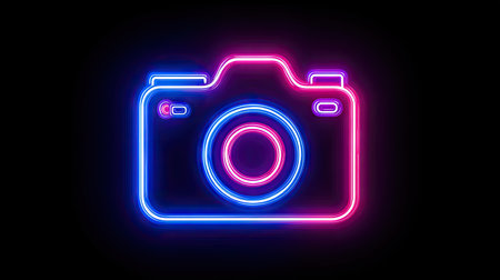 A vibrant neon camera icon shines against a black background. The image presents a glowing outline in blue and pink. The composition showcases a modern aesthetic, suitable for various digital design purposes. It may be used in projects related to photography, technology, and visual communication.の素材
