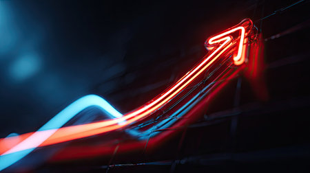 An illuminated red arrow ascends diagonally against a dark backdrop. The composition features blurred light trails suggesting movement and speed. The image uses vibrant red and blue hues to create visual interest. This dynamic illustration is suitable for various commercial applications, including presentations and advertising materials.の素材