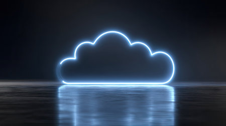 A glowing neon cloud shape dominates a dark, reflective surface. The image presents a futuristic visual, with cool blue light outlining the cloud. The composition emphasizes simplicity and technological themes. It can be used for various digital and commercial applications.の素材