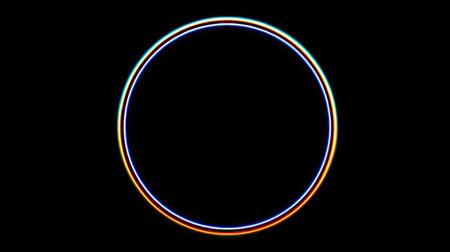 A single, neon-colored circle glows prominently against a stark black background. The design features a smooth, gradient effect with multiple colors, creating a vibrant, luminous impression. The composition is centered, presenting a clean and modern aesthetic suitable for various design projects and visual content.の素材