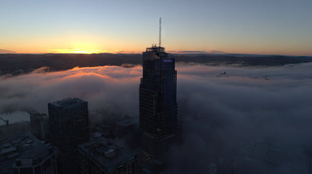 Aerial view of Chicago downtown at sunrise with fog in the foreground.の素材